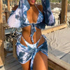 Conjunto bikini tanga con camiseta manga larga y pareo estampado